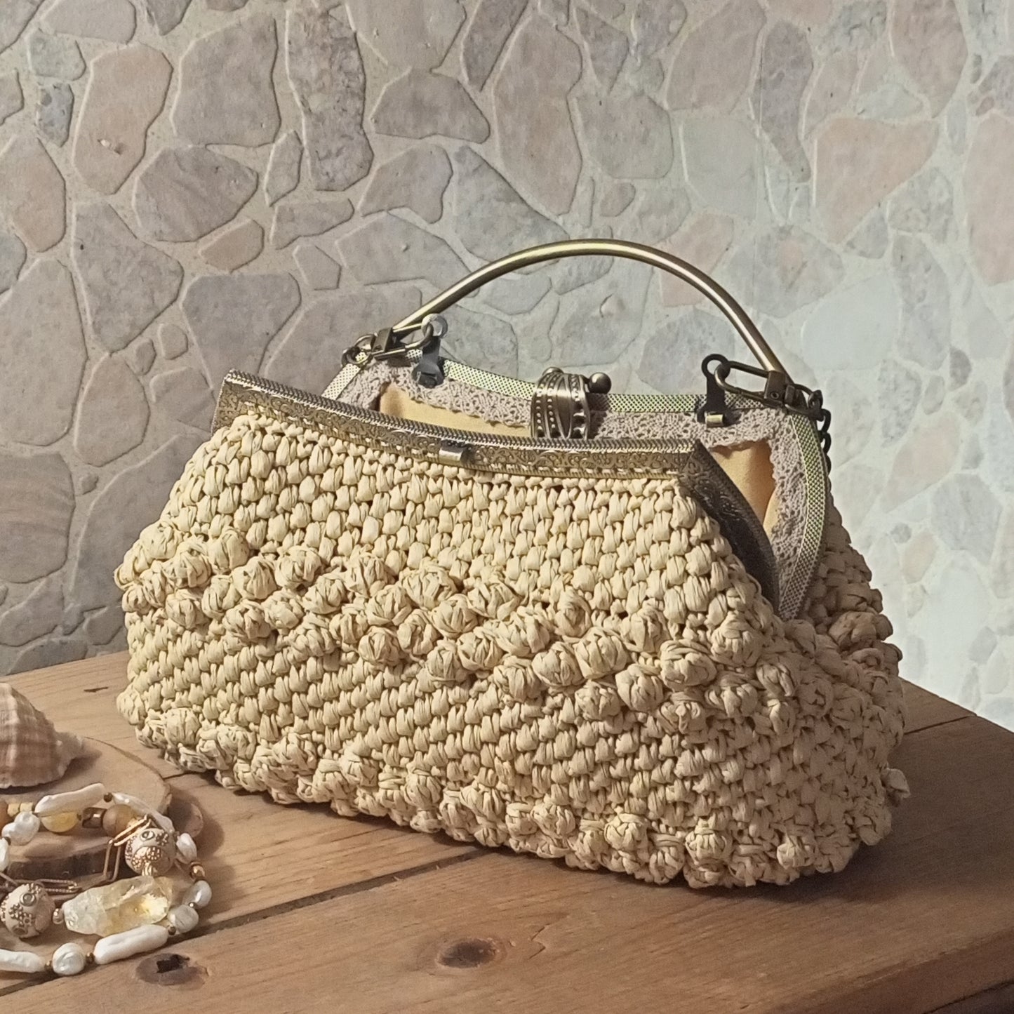 Handmade beige crochet evening purse with metal frame clasp