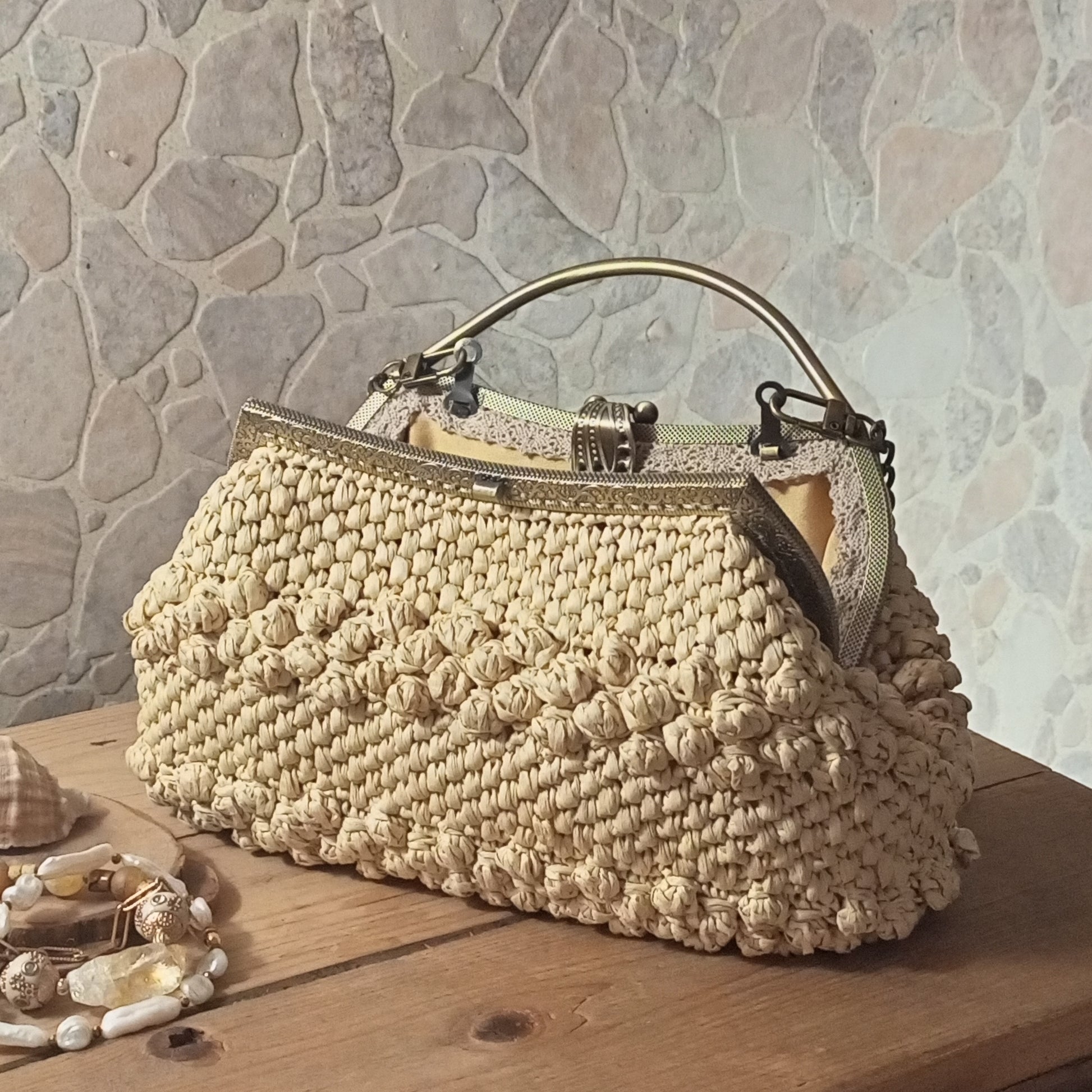 Handmade beige crochet evening purse with metal frame clasp