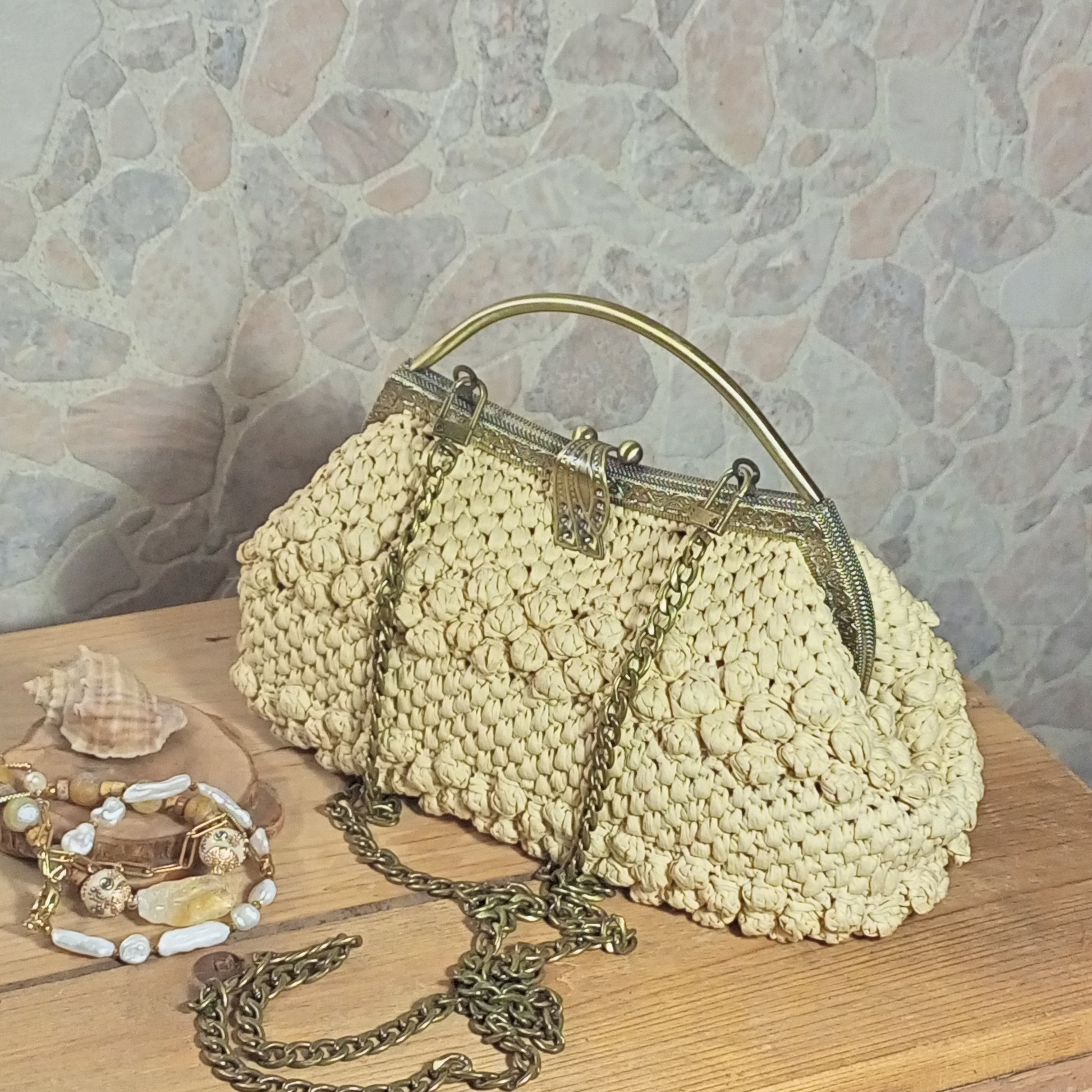 Handmade beige raffia crochet bag with metal frame clasp