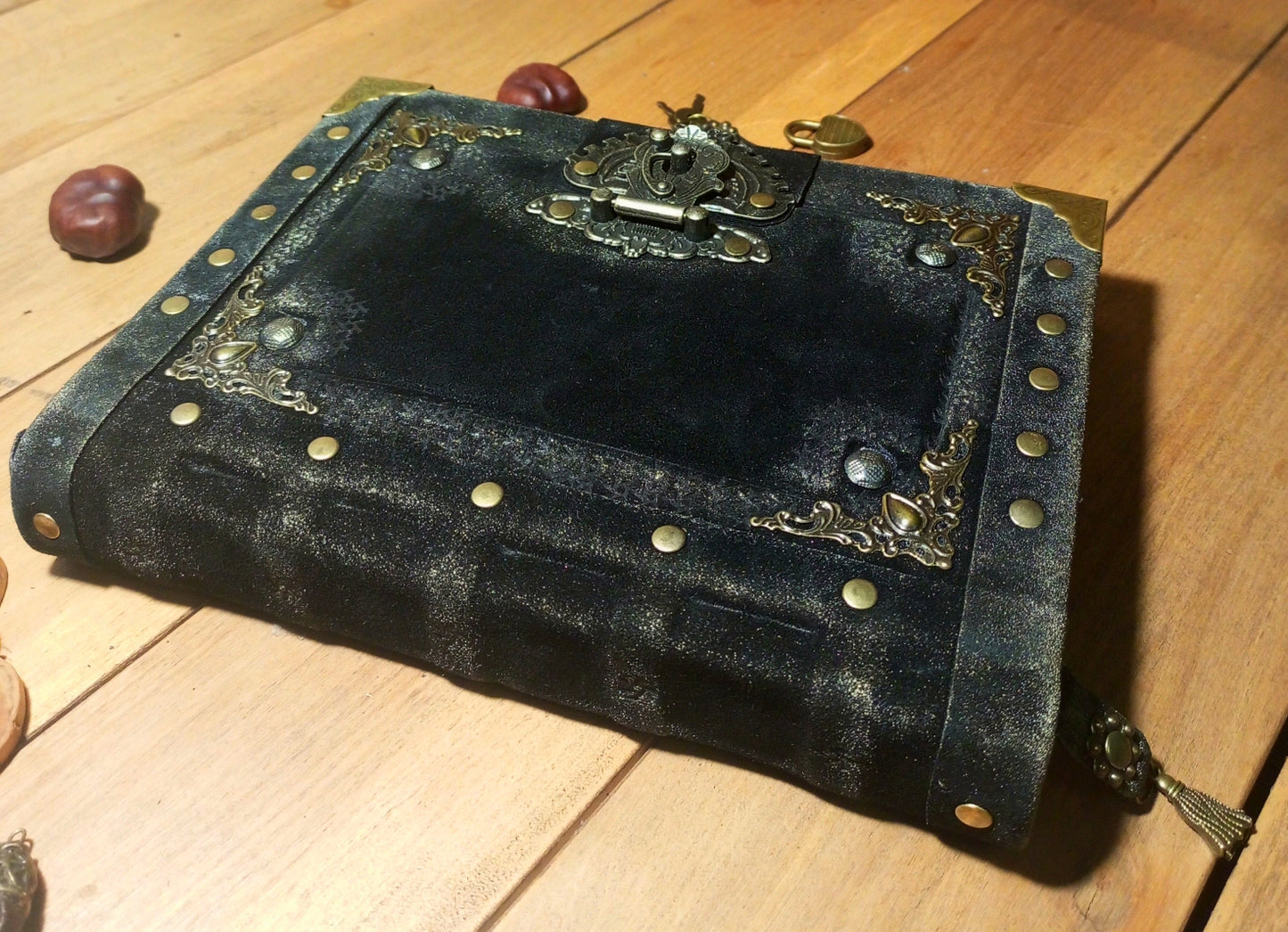 Antique style grimoire handmade black suede journal close-up detail