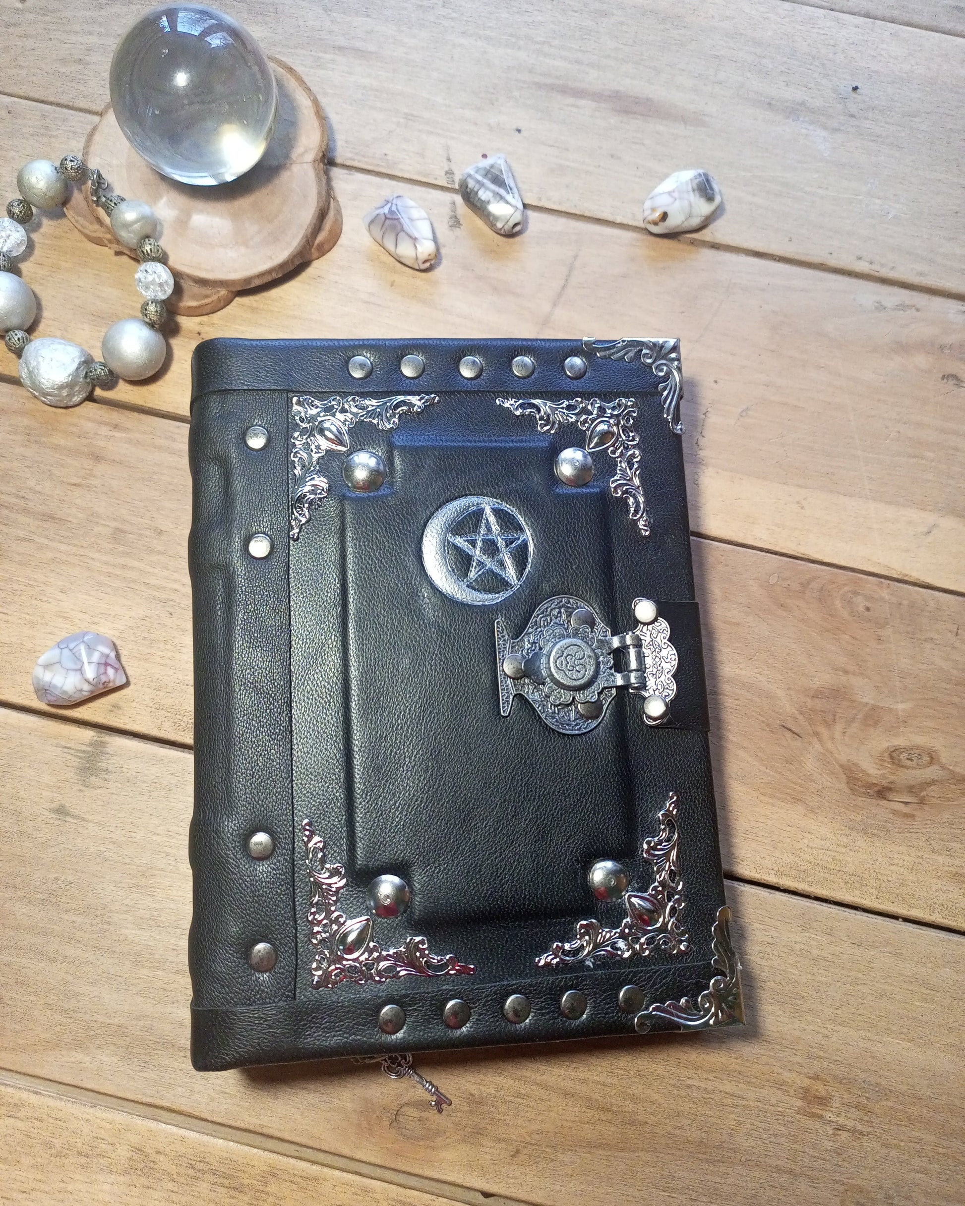 Black aged leather journal with moon and pentogram