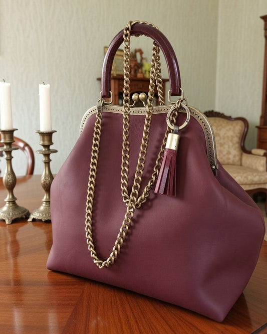Maroon vintage leather bag with kisslock clas and rass chain