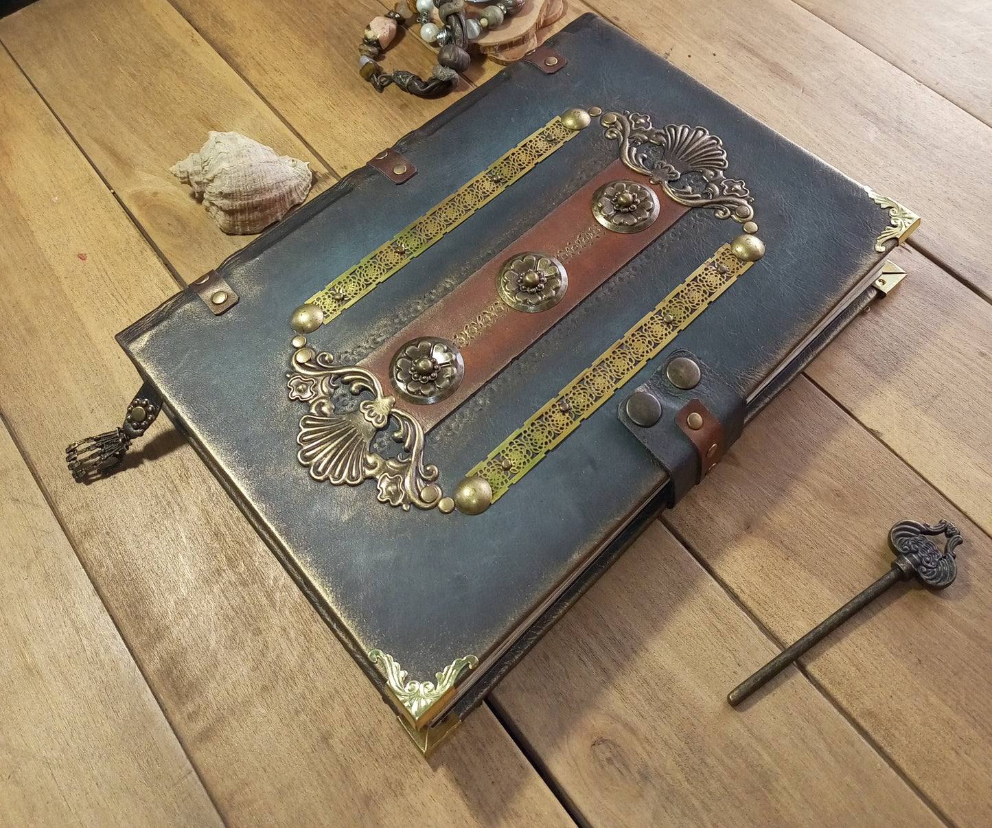 Close-up of antique lock on brown grey leather journal