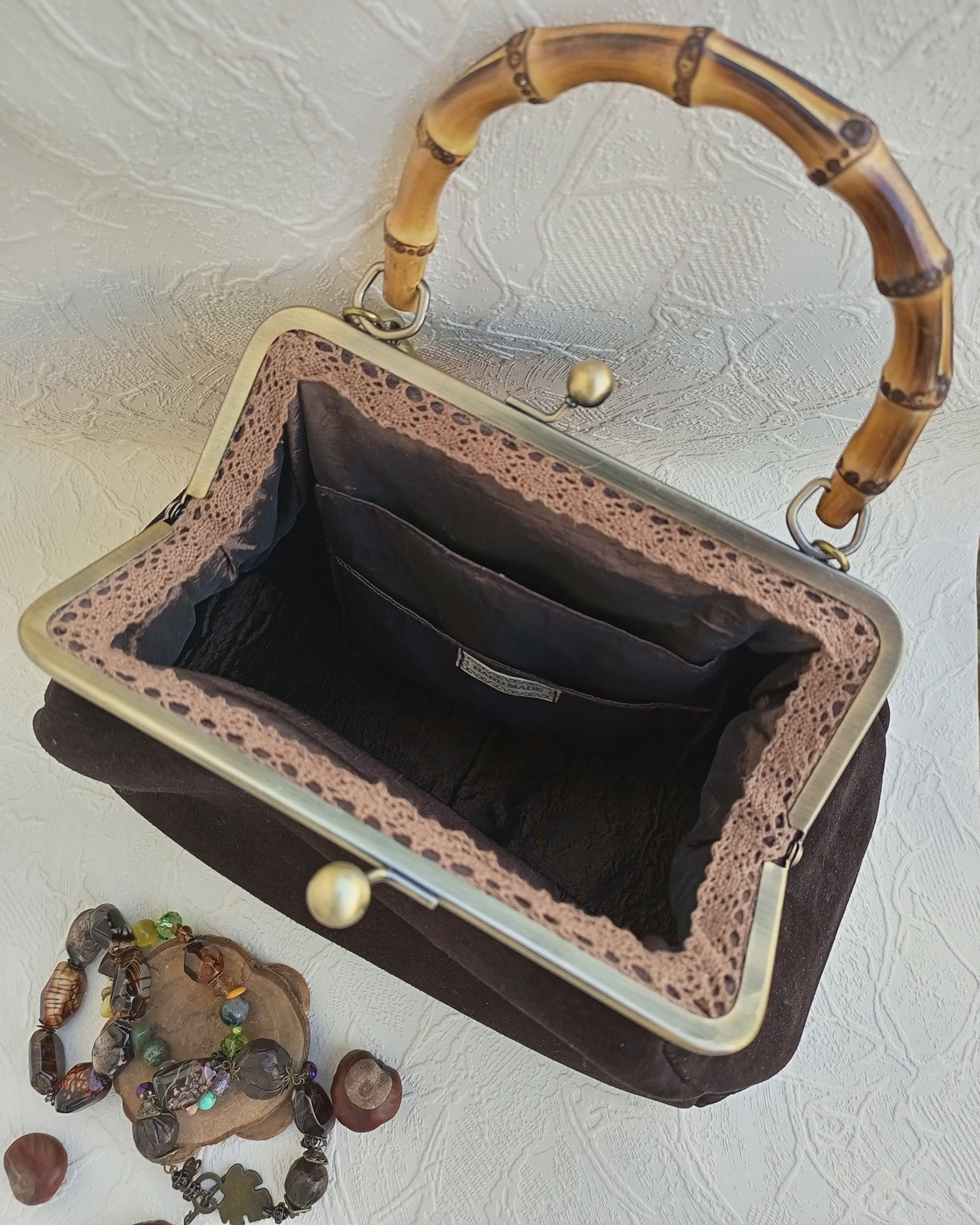 Interior satin lining with pockets brown suede kisslock bag