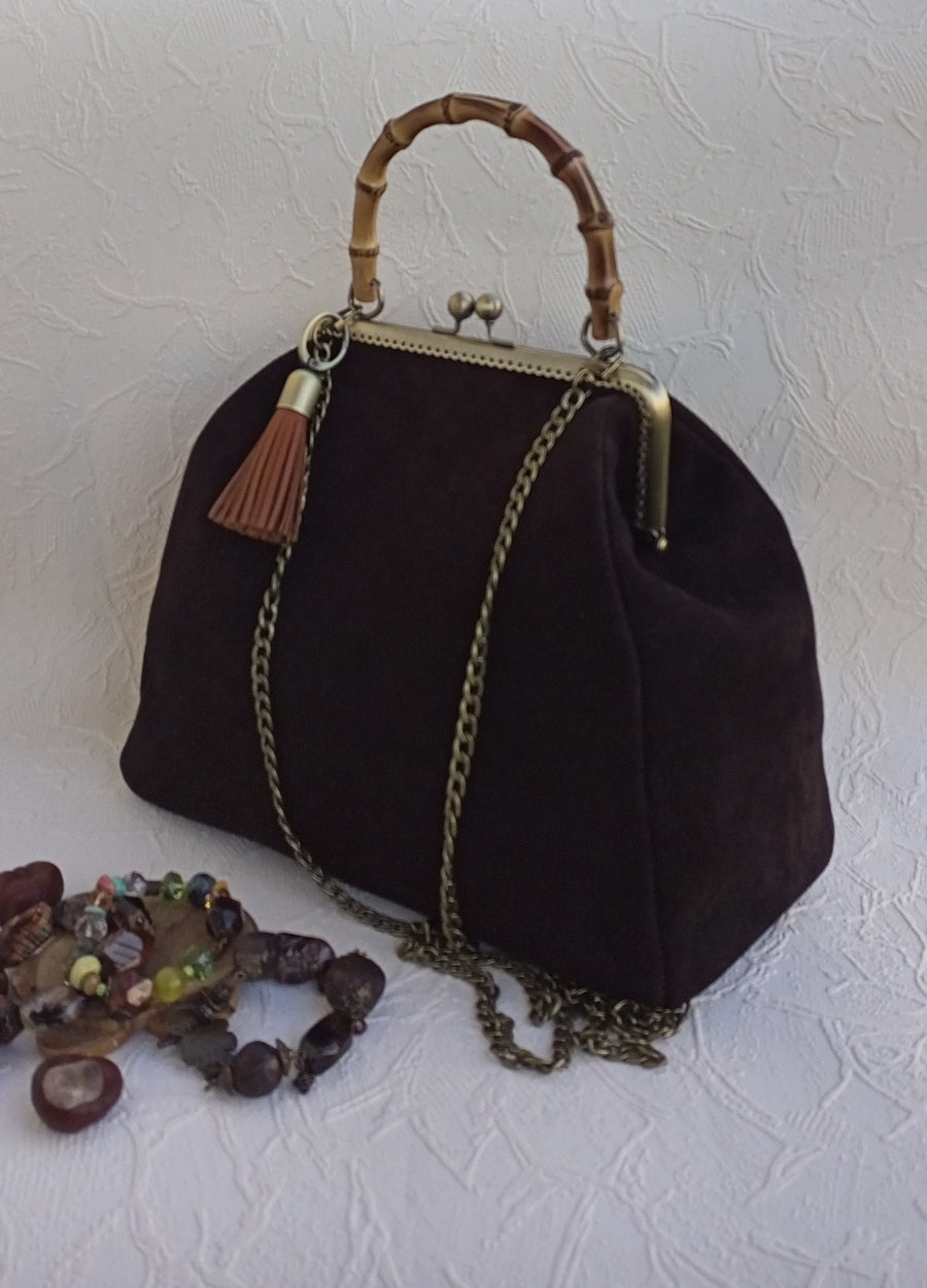 Side detail on brown suede vintage handbag