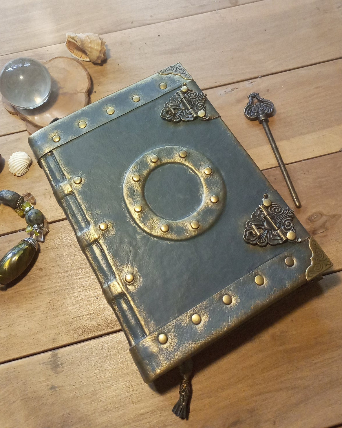 Grey aged  leather book with brass metallic embellishments and antique locks