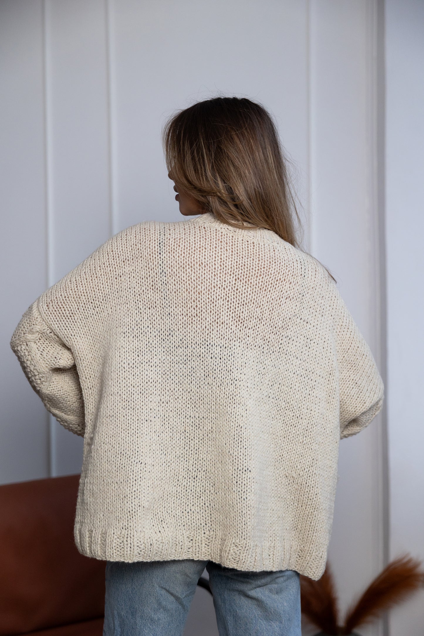 Soft alpaca wool texture ivory knitted sweater close-up