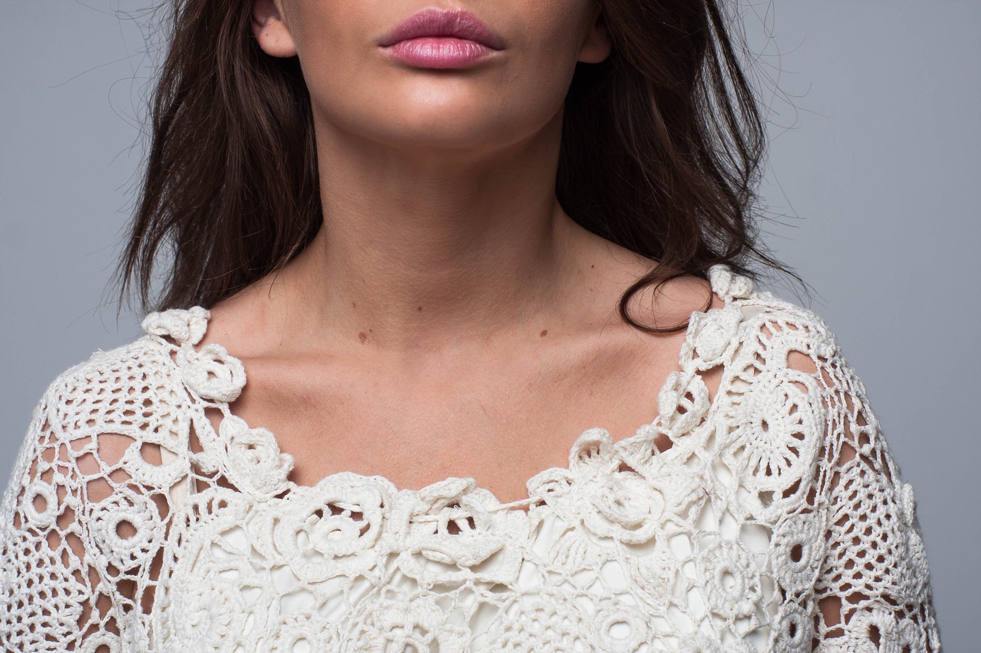 Irish lace crochet neckline detail on ivory wedding dress