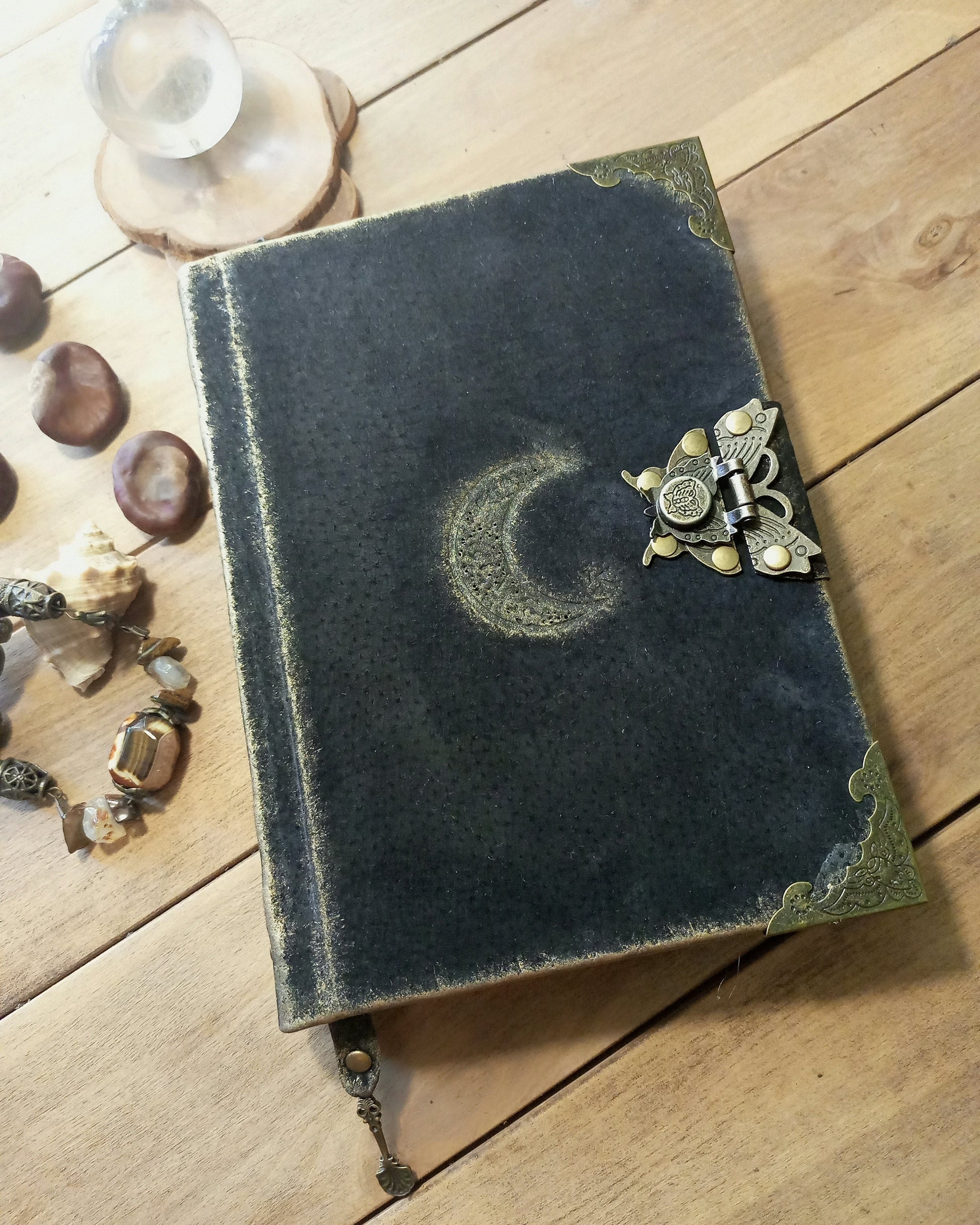 Aged Black leather notebook with celestial design with antique brass lock and mbelishments