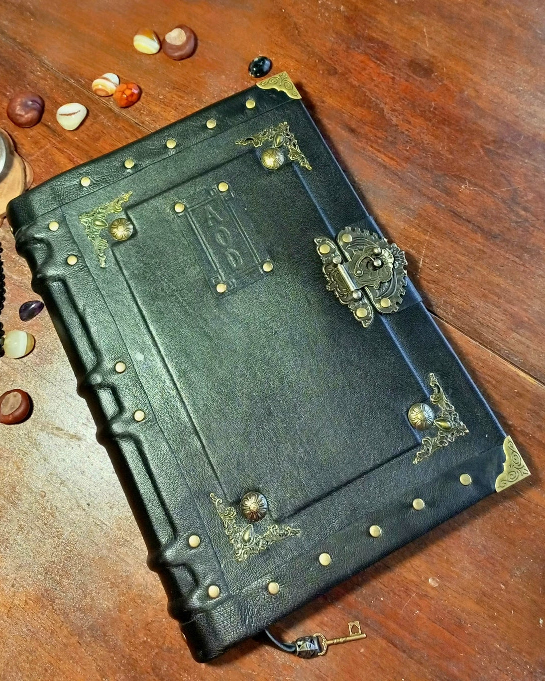 Aged personalized leather jounal with brass embelishments and antique lock