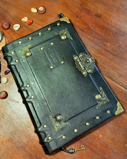 Aged personalized leather jounal with brass embelishments and antique lock