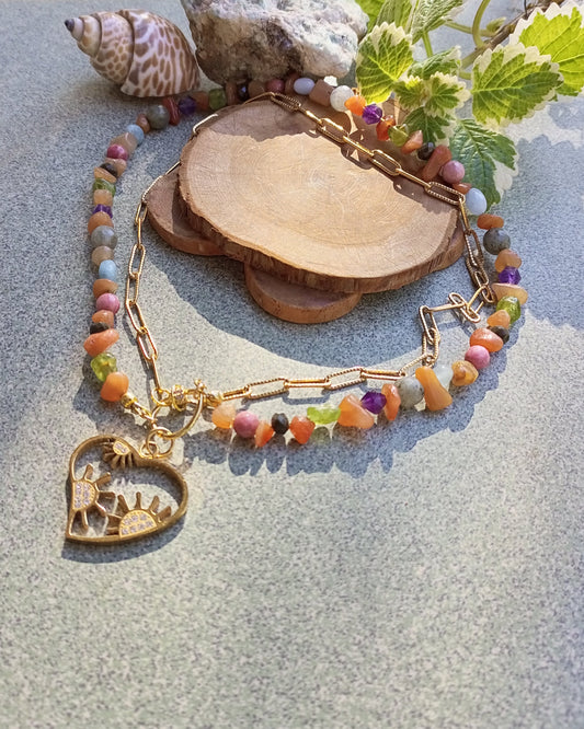Colorful beaded necklace with a heart-shaped pendant and golden 18rk chain
