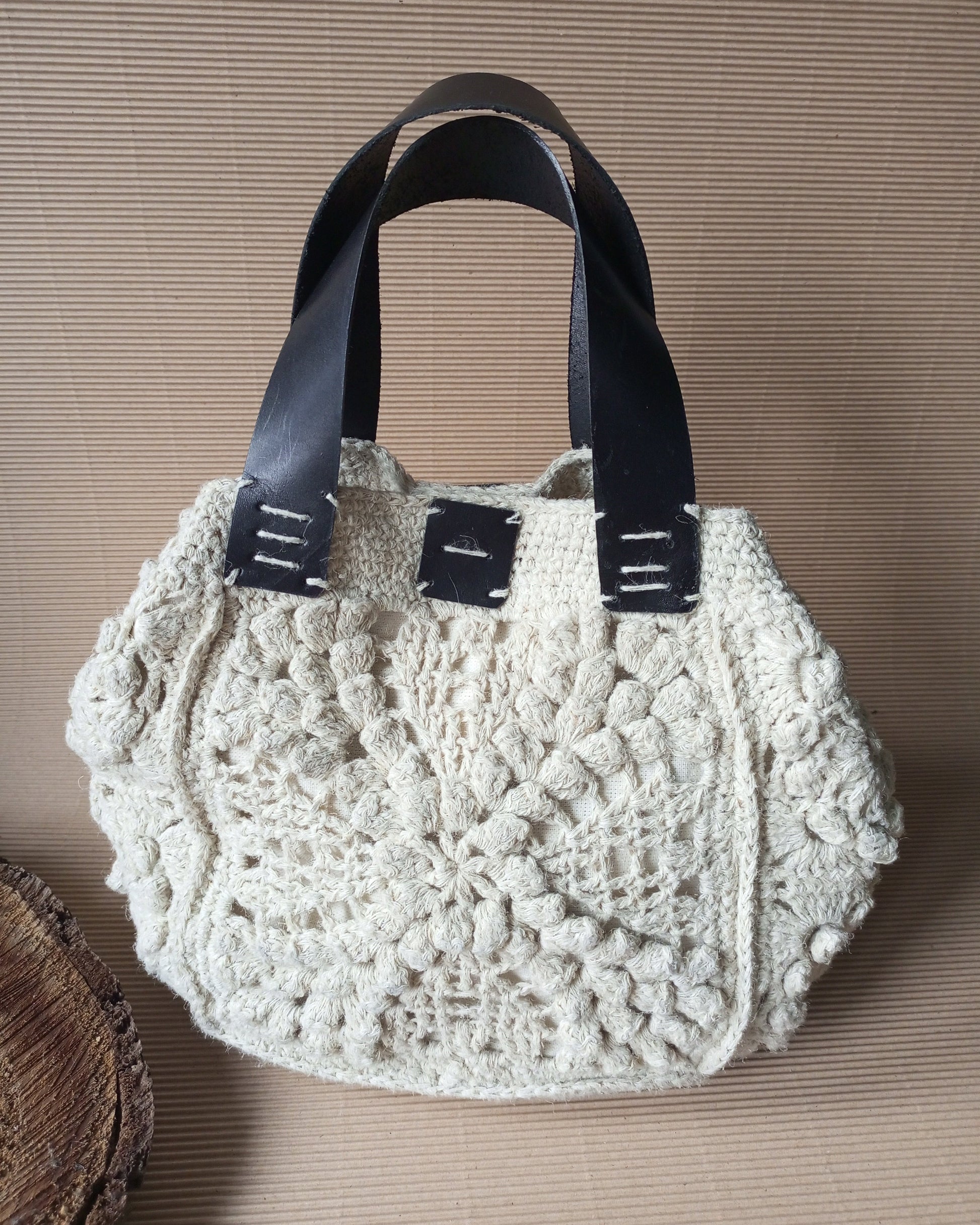 Crocheted ivory hemp handbag with black leather straps 