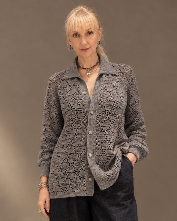 A woman modeling a gey button-up crochet lace oversized shirt
