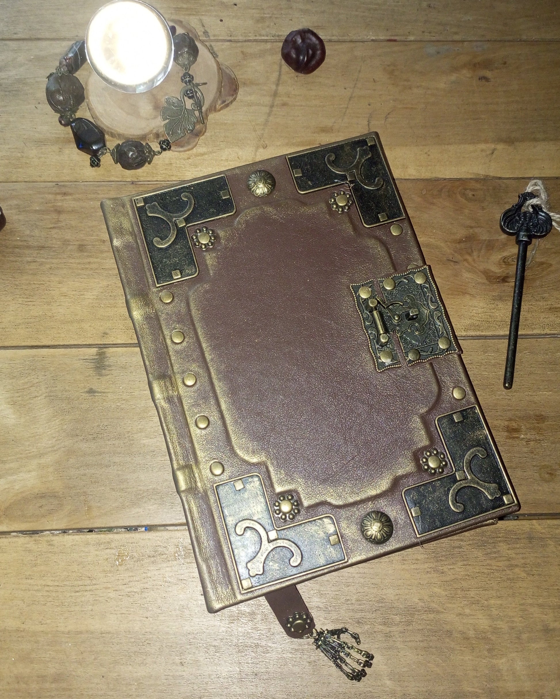 Aged leather brown journal with antique brass embelishments and lock
