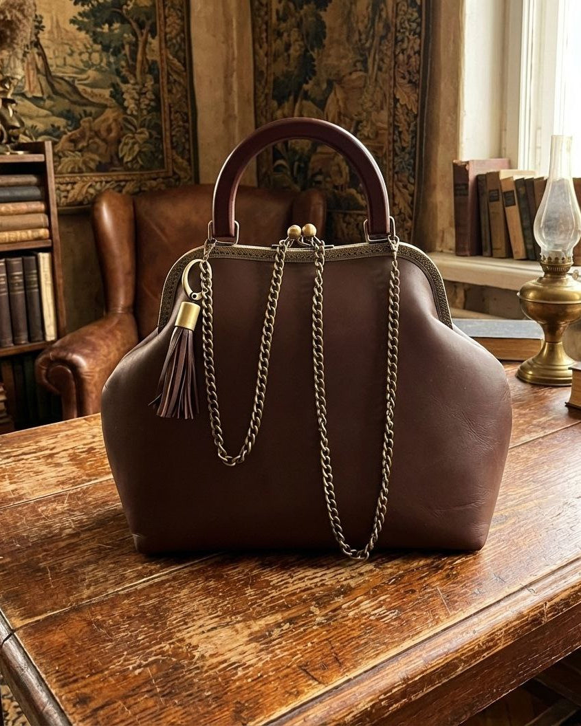 Brown leather bag with kisslock and removable chain nd leather tassel