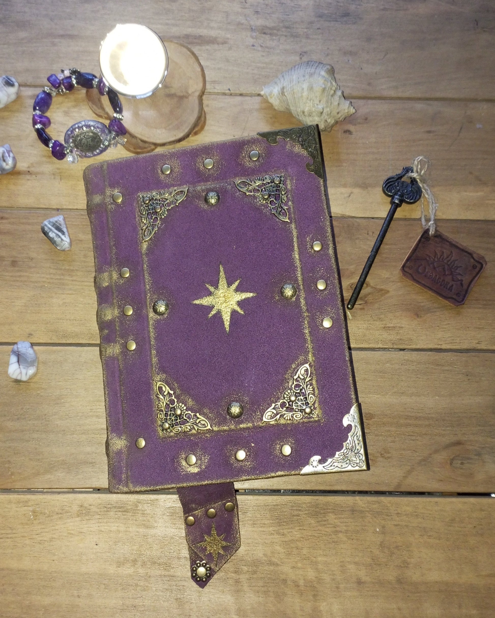 Purple aged suede book with gold celestial star design 