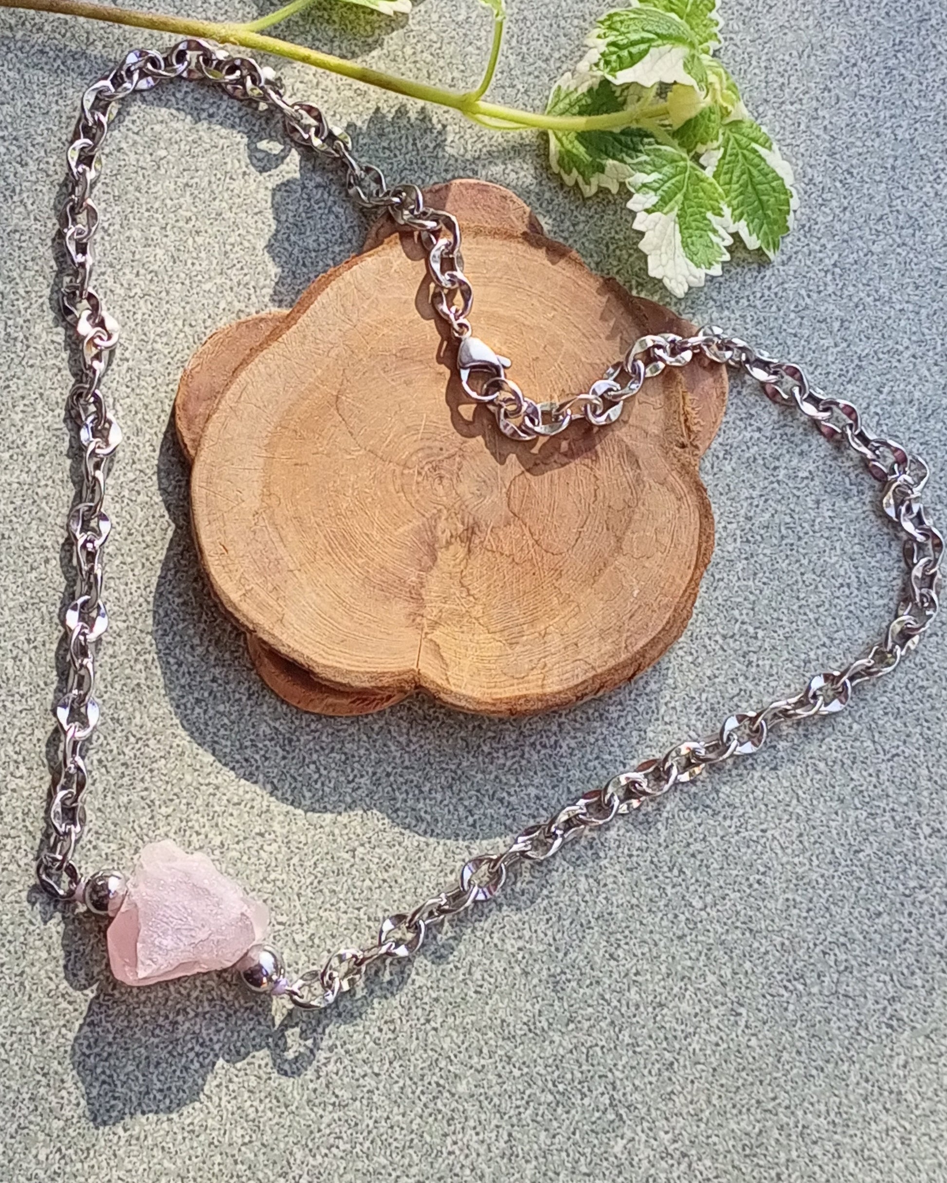 rose quartz necklace with raw pink gemstone nugget pendant and stainless steel chain