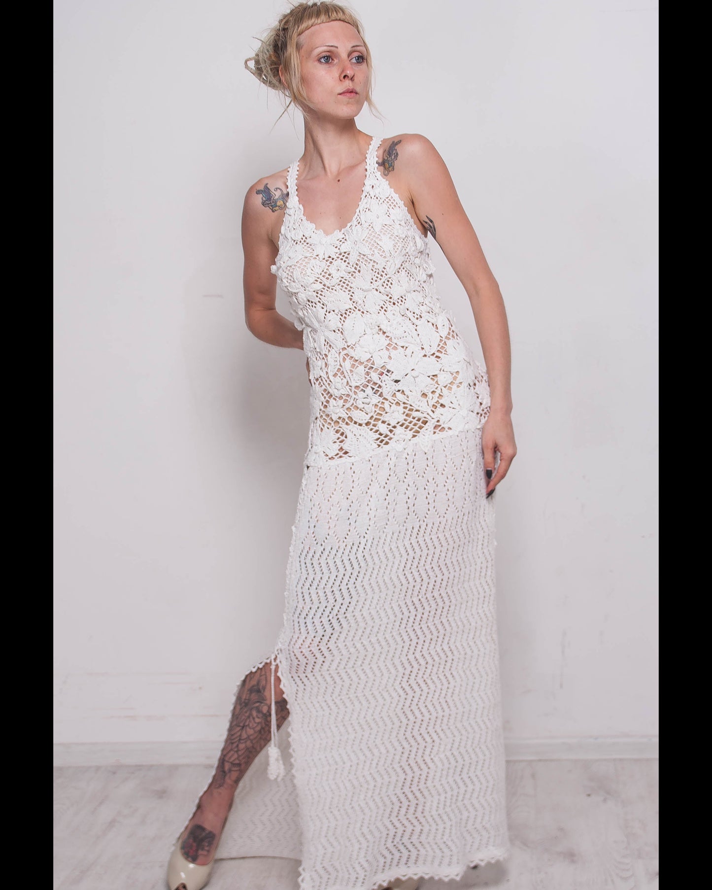 Woman wearing a crochet white maxi lace dress for resorts and weddings